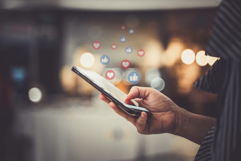 Hand Using Smartphone With Social Media Concept | Navazon Digital