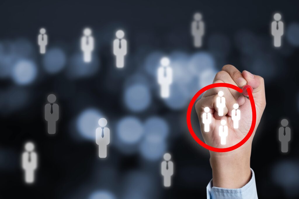 persons hand circling 4 people on a clear white board with other figures on the screen | Navazon Digital persons hand circling 4 people on a clear white board with other figures on the screen | Navazon Digital