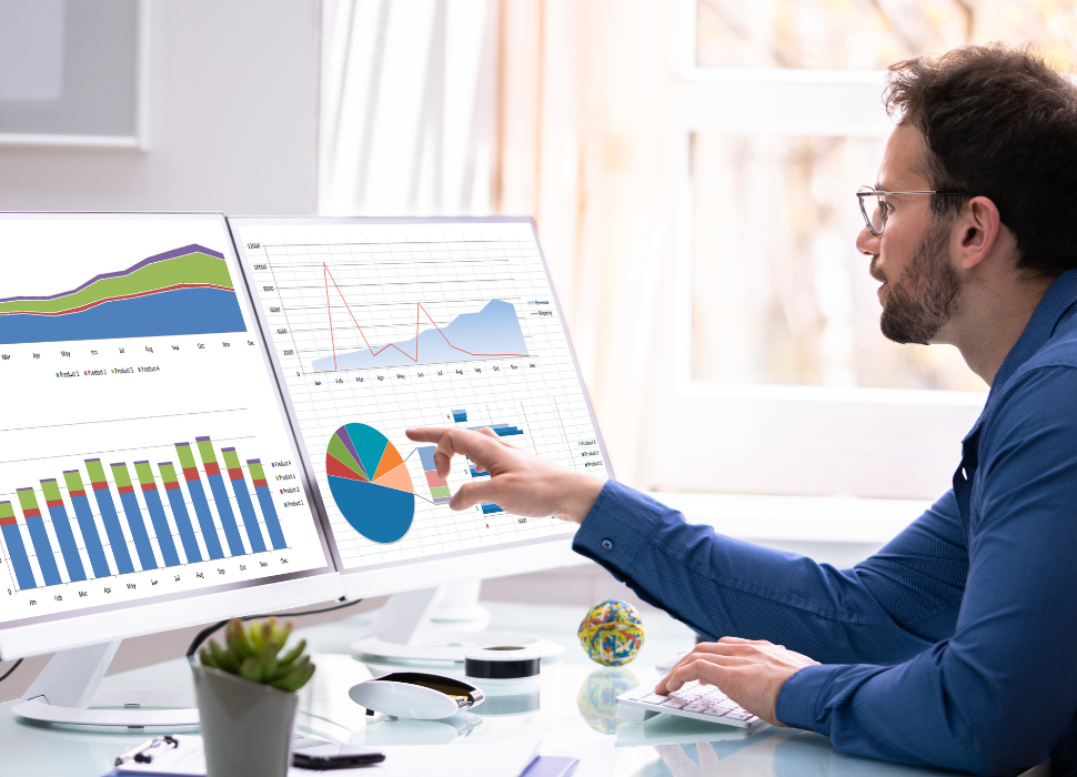 guide to web design / analytics on a screen and a man looking on computers | Navazon Digital