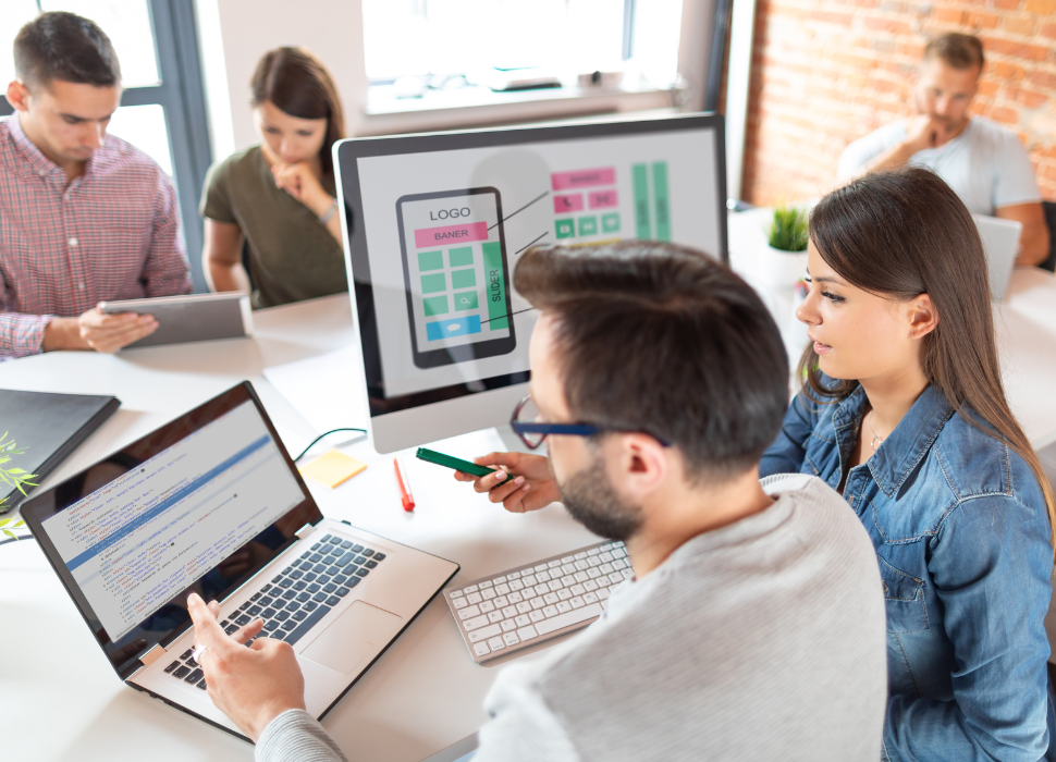 guide to web design / two people looking at computers working on a website | Navazon Digital